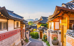 A Narrow Street With A Lot Of Buildings Wallpaper