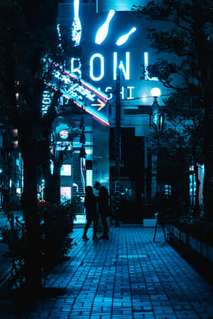 A Neon Sign On A Brick Sidewalk Wallpaper