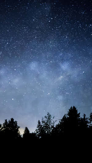 A Night Sky Showcasing The Majestic Beauty Of A Dark Starry Night. Wallpaper