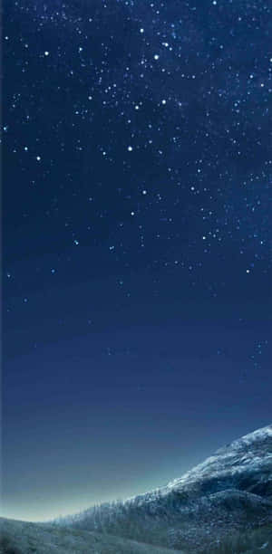 A Night Sky With Stars And A Mountain Wallpaper