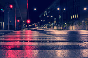 A Nighttime Stroll Down An Empty Street Wallpaper