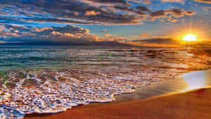 A Nostalgic Summer Moment With A Laptop On The Beach Wallpaper