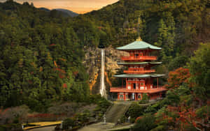 A Pagoda In The Forest With A Waterfall Wallpaper