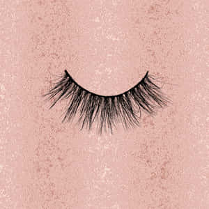 A Pair Of False Eyelashes On A Pink Background Wallpaper