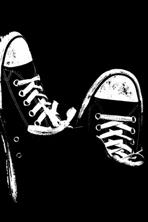 A Pair Of Stylish And Trendy Cute Shoes Hanging Against A Colorful Background Wallpaper