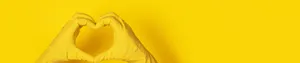 A Pair Of Yellow Gloves On A Yellow Background Wallpaper
