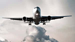 A Passenger Aircraft Takes Off Into The Sky. Wallpaper