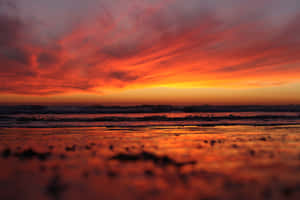 A Peaceful Sky Over A Sandy Beach Wallpaper