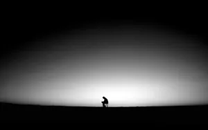 A Pensive Black Man In Deep Contemplation Wallpaper