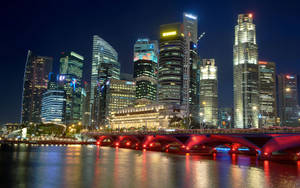 A Perfect Evening In The City, With A Red Bridge Connecting Us All Wallpaper