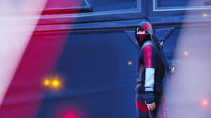 A Person In A Red And Black Outfit Standing In Front Of A Door Wallpaper