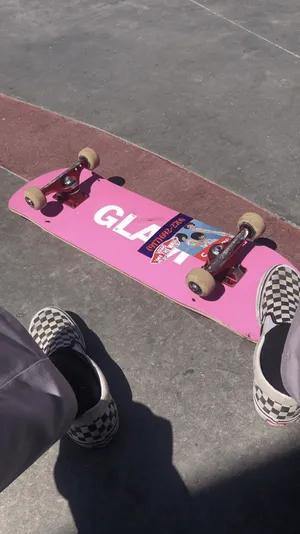 A Person Is Sitting On A Skateboard Wallpaper