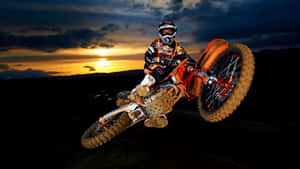 A Person Riding A Dirt Bike Wallpaper