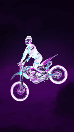 A Person Riding A Dirt Bike In The Air Wallpaper