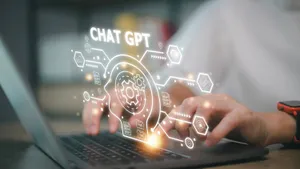 A Person Typing On A Laptop With The Word Chat Gpt On It Wallpaper