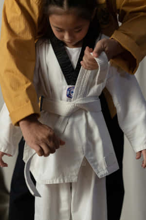 A Person Wearing A Taekwondo Uniform; Ready For Action Wallpaper