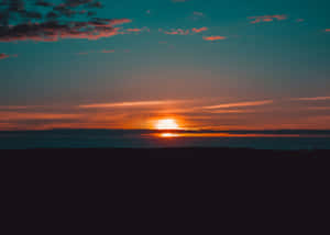 A Picture Of A Tranquil Beach, Perfect For A Relaxing Vacation Wallpaper