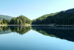 A Picture-perfect View Of A Snow-capped Mountain Lake Wallpaper