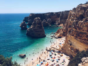 A Picturesque View Of The Stunning Portuguese Beach Wallpaper