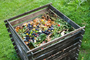 A Pile Of Nutrient-rich Compost In A Garden Bed Wallpaper