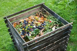 A Pile Of Nutrient-rich Compost In A Garden Bed Wallpaper