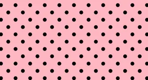 A Pink Background With Black Dots Wallpaper
