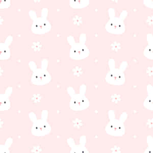 A Pink Background With White Bunny Faces And Flowers Wallpaper