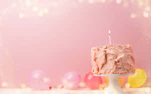 A Pink Cake On A White Plate With Balloons On A Pink Background Wallpaper