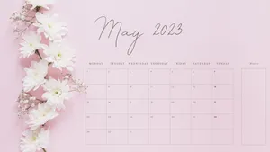 A Pink Calendar With White Flowers On It Wallpaper