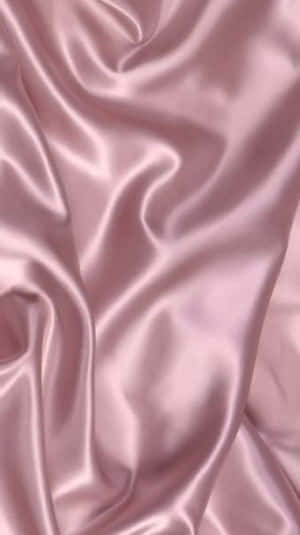 A Pink Satin Fabric With A Smooth Texture Wallpaper