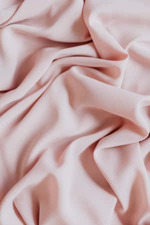 A Pink Silk Fabric With A Smooth Texture Wallpaper