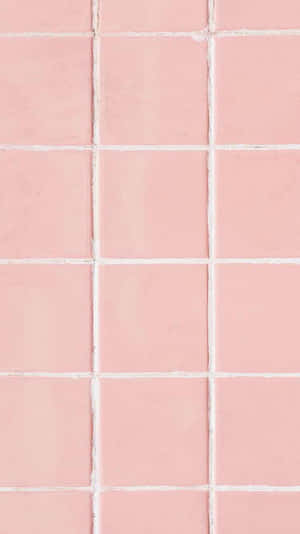 A Pink Tile With White Squares On It Wallpaper