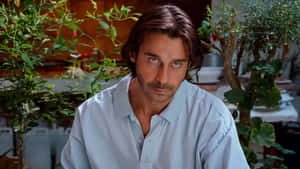 A Poised Jordi Mollà Radiating Intensity On The Big Screen Wallpaper