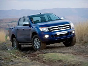 A Powerful Ford Ranger In Action On A Rugged Off-road Trail Wallpaper