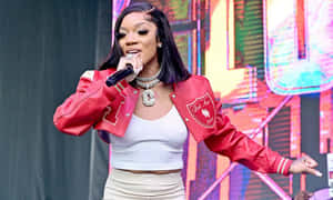 A Powerful Glorilla Seated Upon A Broken Wall In A Mysterious City Wallpaper