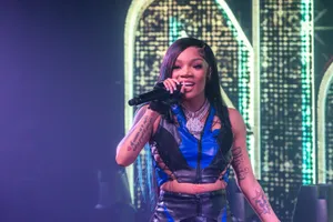 A Powerful Gorilla Sitting On Life's Throne Wallpaper