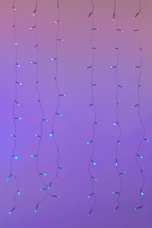 A Purple And Blue Light String Hanging From A Purple Wall Wallpaper