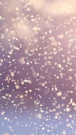 A Purple And Pink Background With Snowflakes Wallpaper
