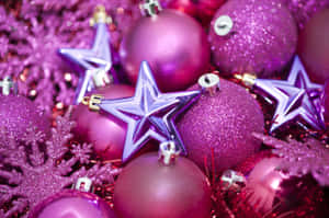 A Purple Christmas Tree With Stars And Ornaments Wallpaper