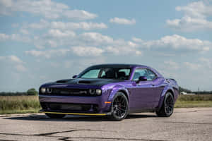 A Purple Dodge Challenger Srt Parked On A Road Wallpaper