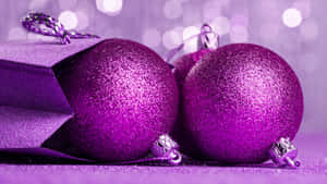 A Purple Festive Scene In Celebration Of Christmas Wallpaper