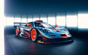 A Racing Car In A Dark Room Wallpaper