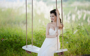 A Radiant Bride In Her Wedding Dress Wallpaper