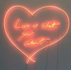 A Radiant Orange Heart Shines Bright Wallpaper