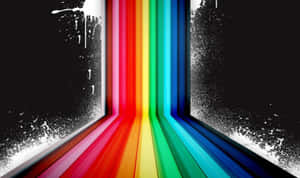 A Rainbow Colored Background With Paint Splatters Wallpaper