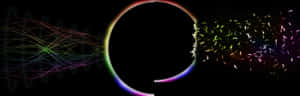 A Rainbow Colored Light Is Coming Out Of A Circular Shape Wallpaper