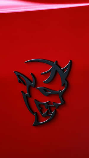 A Red Car With A Devil Hood Emblem Wallpaper