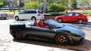 A Red Ferrari F430 In Motion On A Scenic Road Wallpaper