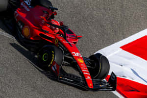 A Red Ferrari Racing Car On A Track Wallpaper