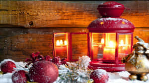 A Red Lantern With Candles And Ornaments On A Wooden Background Wallpaper